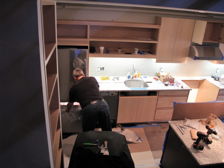 custom cabinets and floating shelves installation in progress during renovation