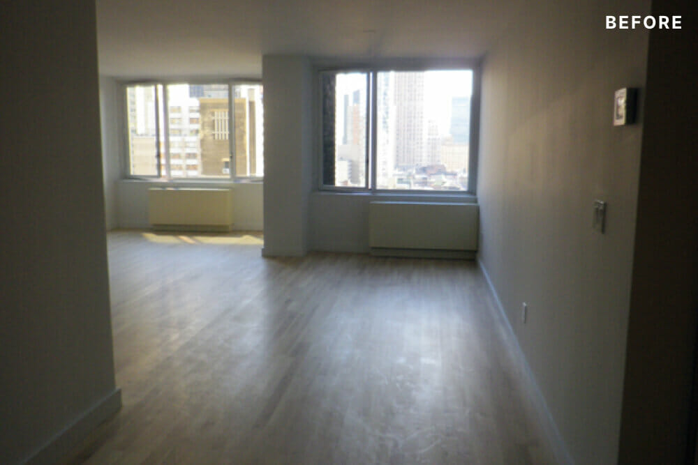 view of room with hardwood floors and windows and radiators before renovation