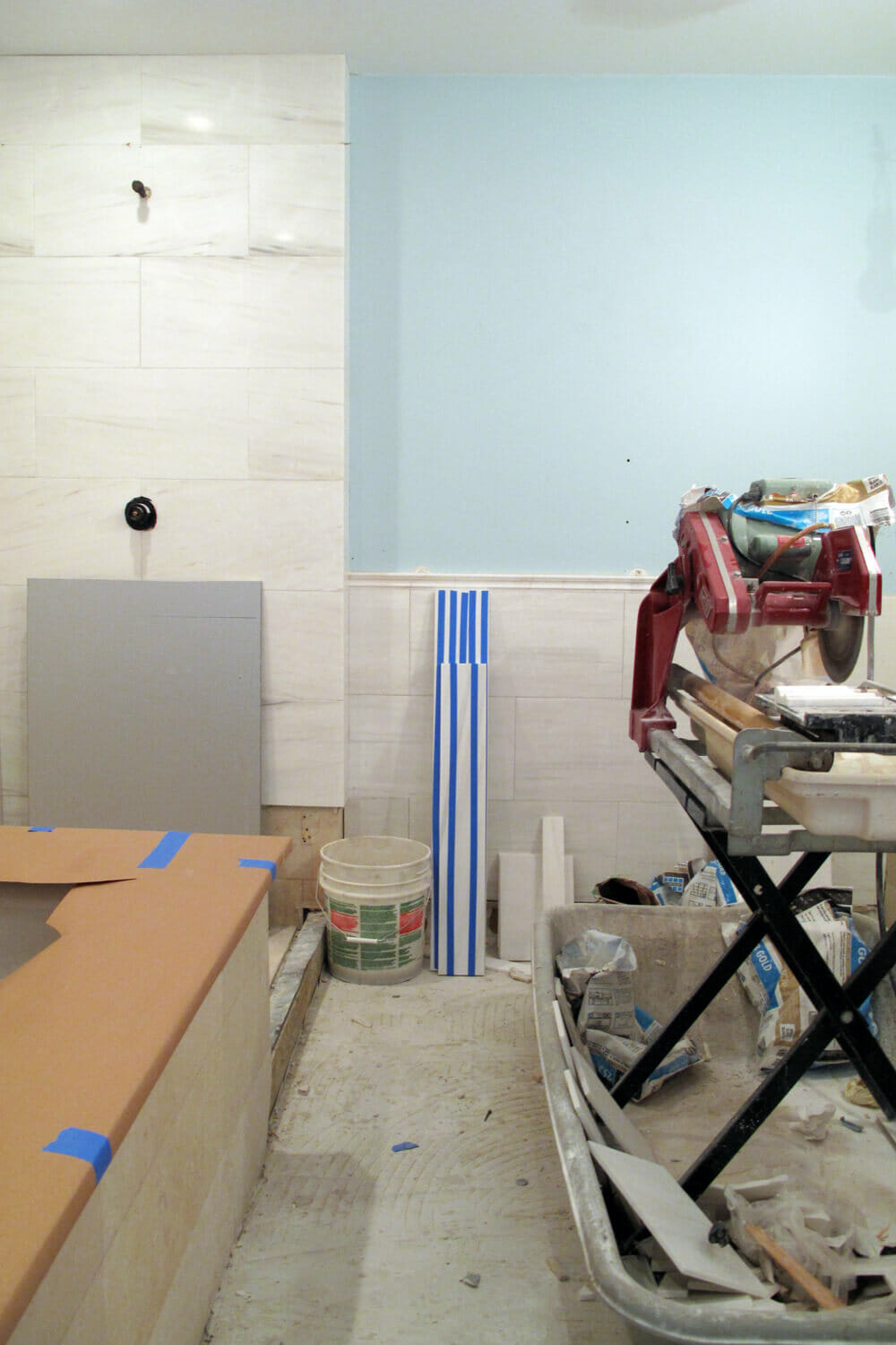 bathtub and wall and floor tiles installation in a bathroom during renovation