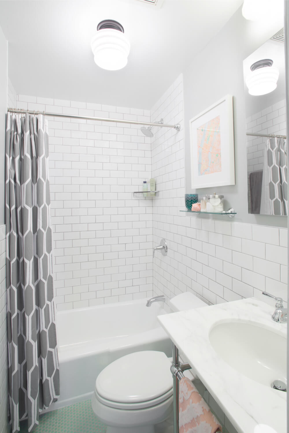 bathroom with white subway wall tiles and nickel fixtures and light green floor tiles and console basin sink after renovation