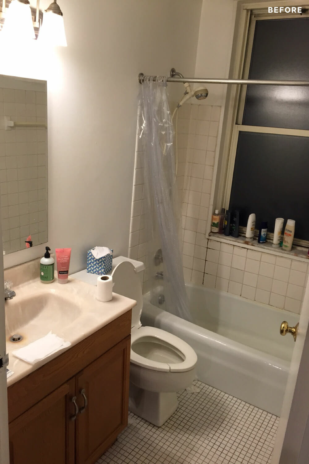 full bathroom with tile flooring and bathtub with window sill and vanity with mirror before renovation