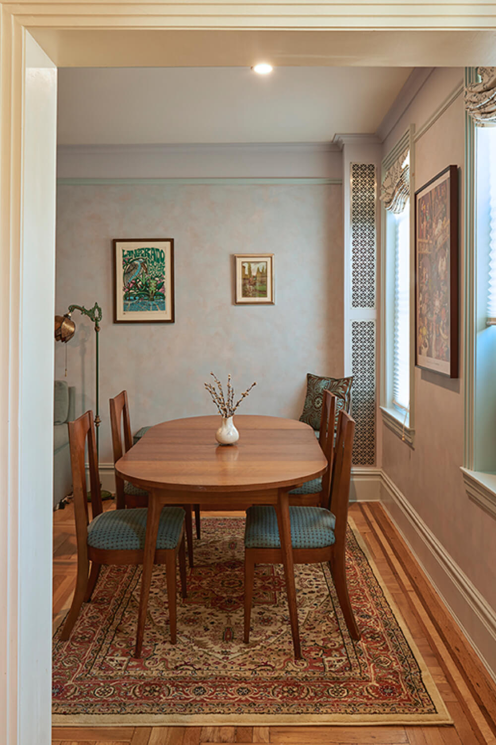 dining room with hardwood floors and crown molding and shoe molding and windows with frames after renovation