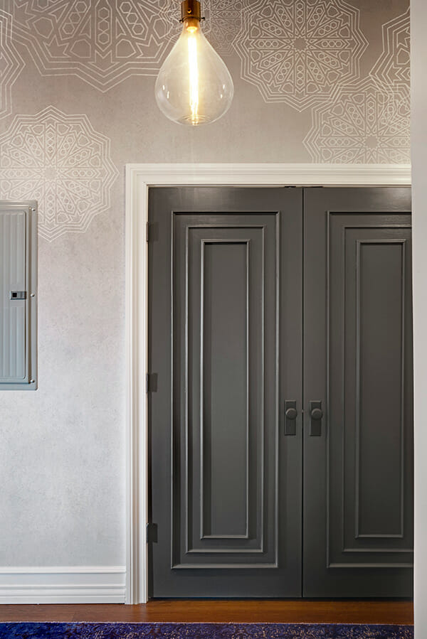 classic dark gray door and restoration hardware pendant lighting