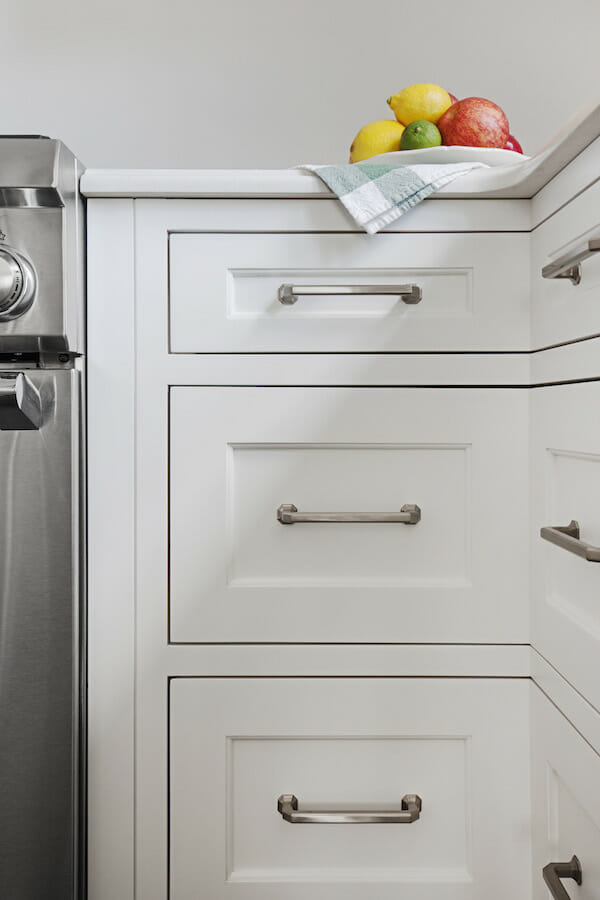 white cabinets with metal pulls