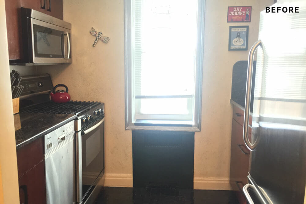 View of the kitchen with dark cabinetry before renovation
