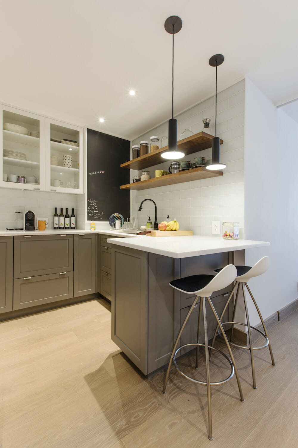 White and gray kitchen in studio apartment