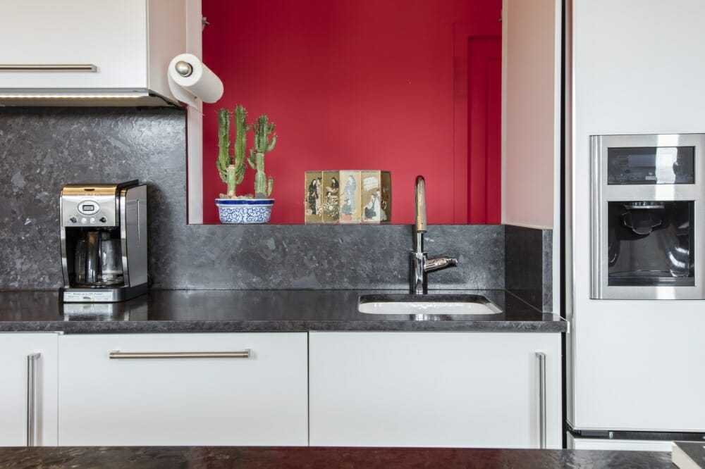 Modern kitchen with red accent wall