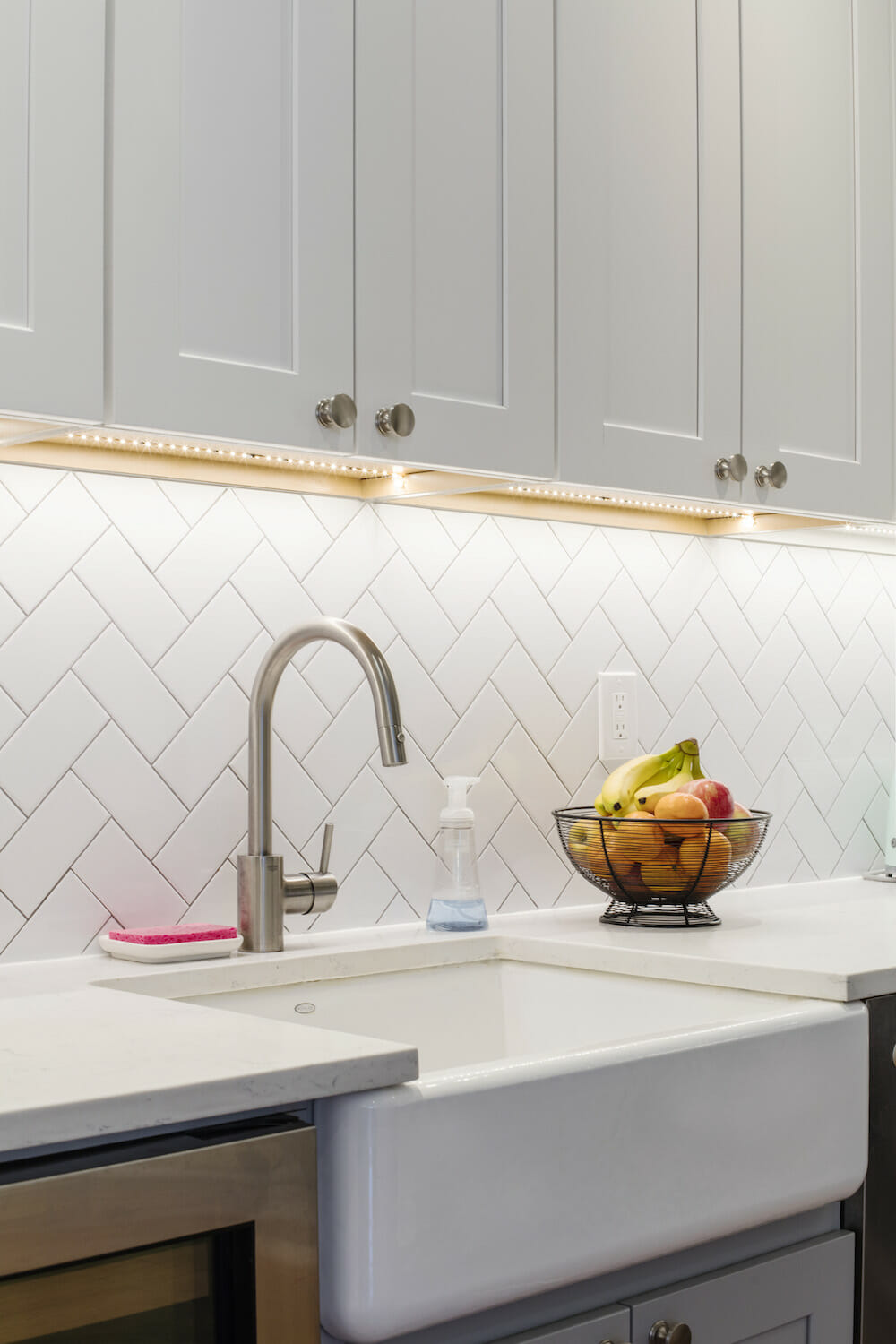 chevron-patterned white subway tile kitchen