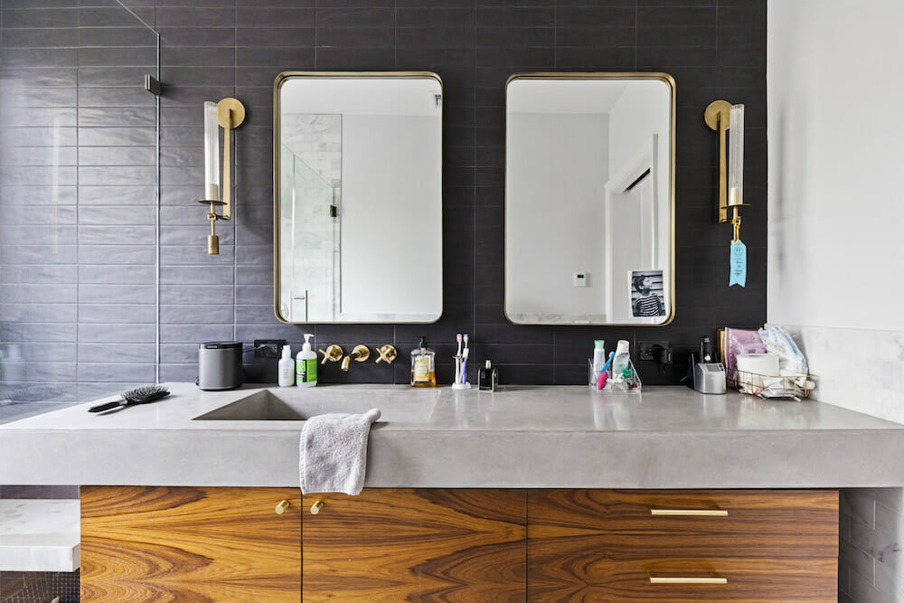 This golden wall mount bathroom faucet compliments other gold fixtures in the space