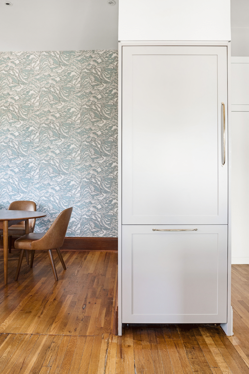 large white paneled cabinets for refrigerator after renovation