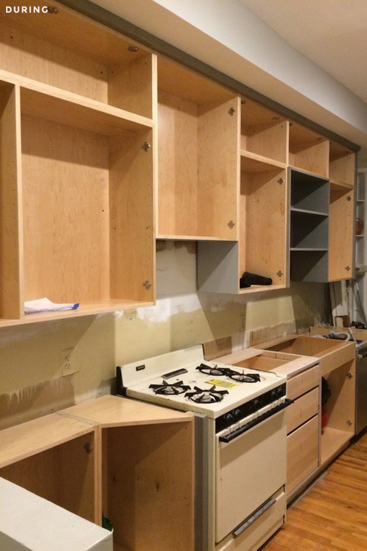 building the custom wooden cabinets in kitchen during renovation