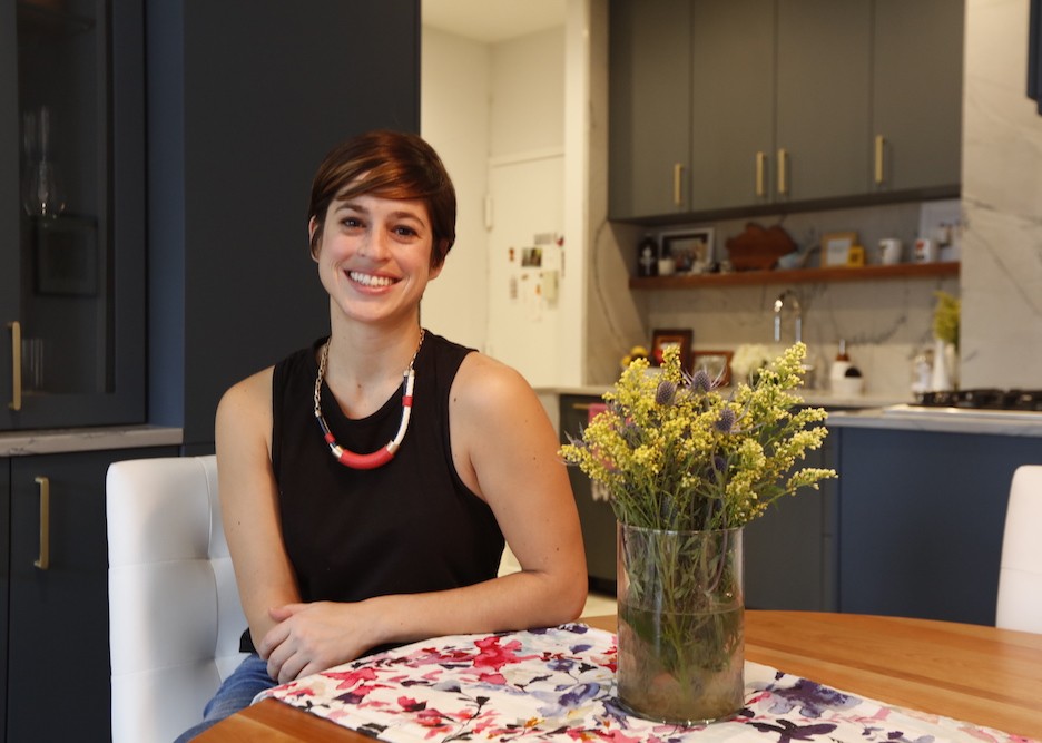 happy homeowner in a renovated kitchen