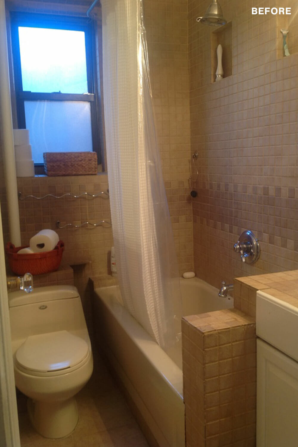 compact bathroom with brown tiles on walls and floor and toilet and bathtub before renovation