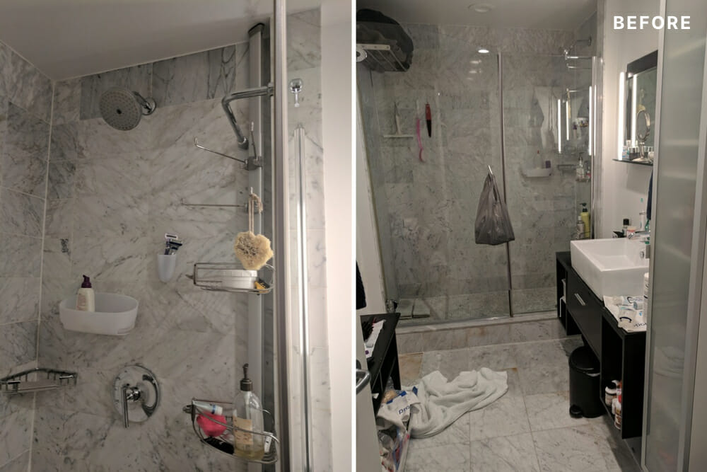 Gray marble bathroom with shower head and wall fixtures before renovation