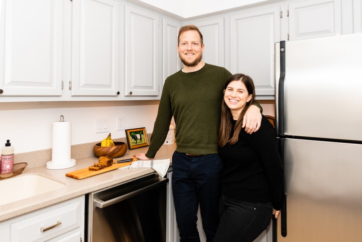 happy couple in their renovated kitchen