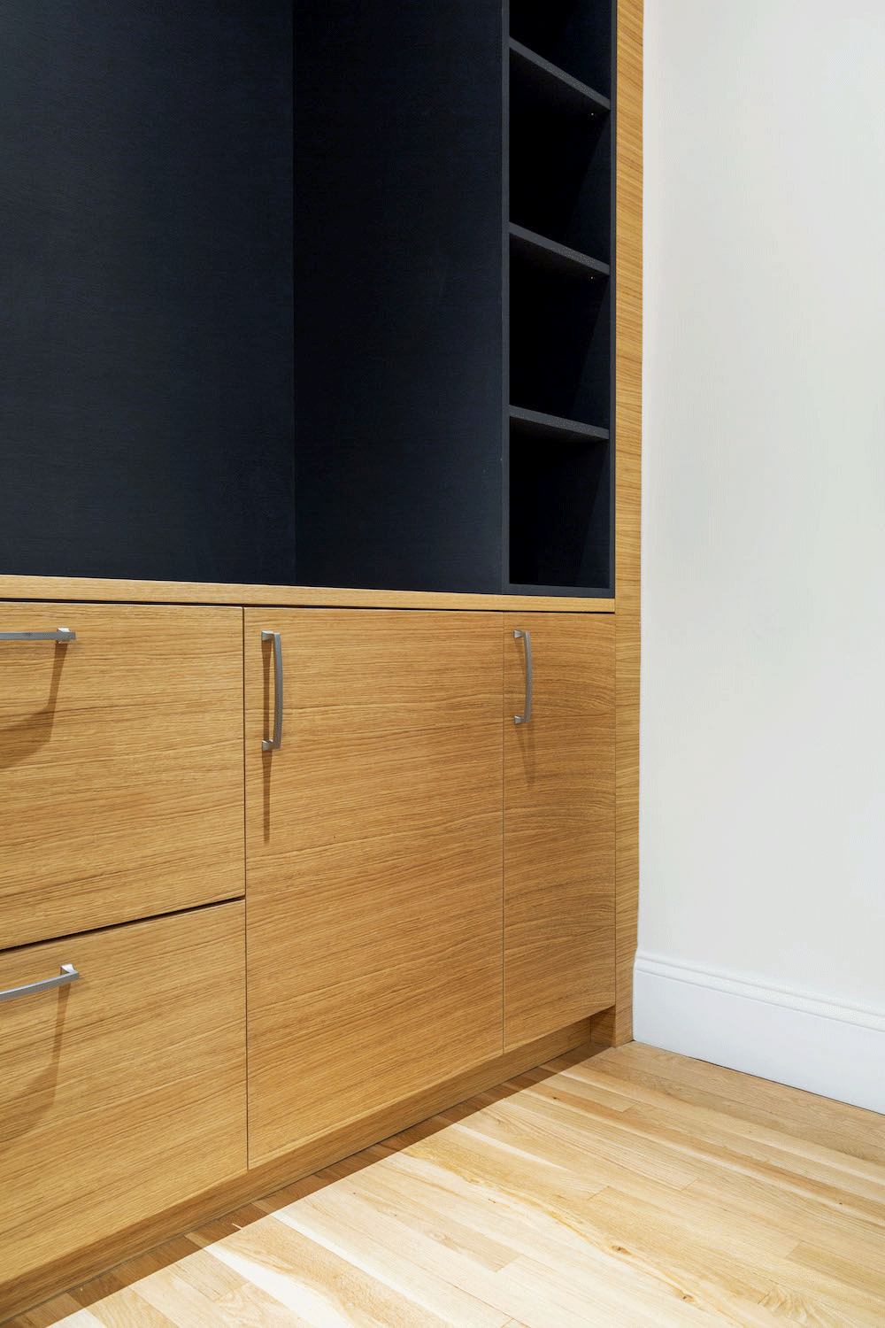 brown wooden custom cabinets with open and closed shelves after renovation