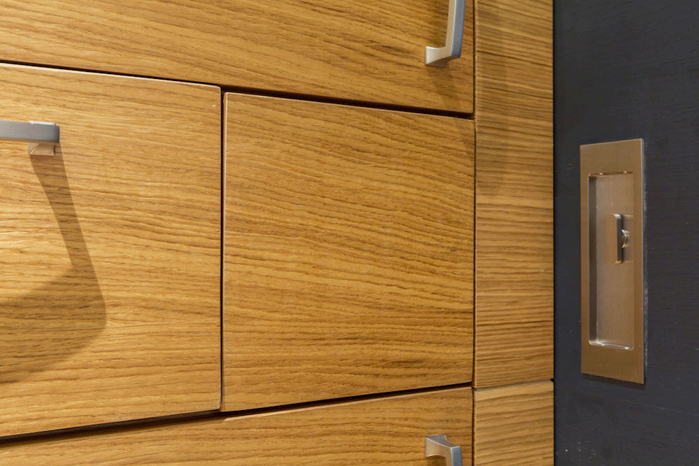 wood veneer cabinetry and small compartments for light swiches after renovation