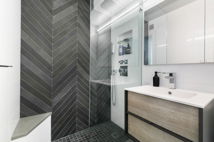 renovation, apartment combination, bathroom, glass shower door, chevron tile