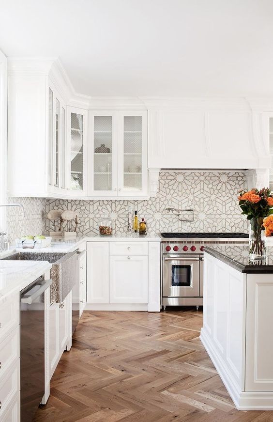 herringbone renovation, hardwood floors, herringbone, tile backsplash, white cabinets, island
