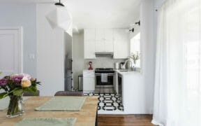 Image of black and white kitchen with white cabinets
