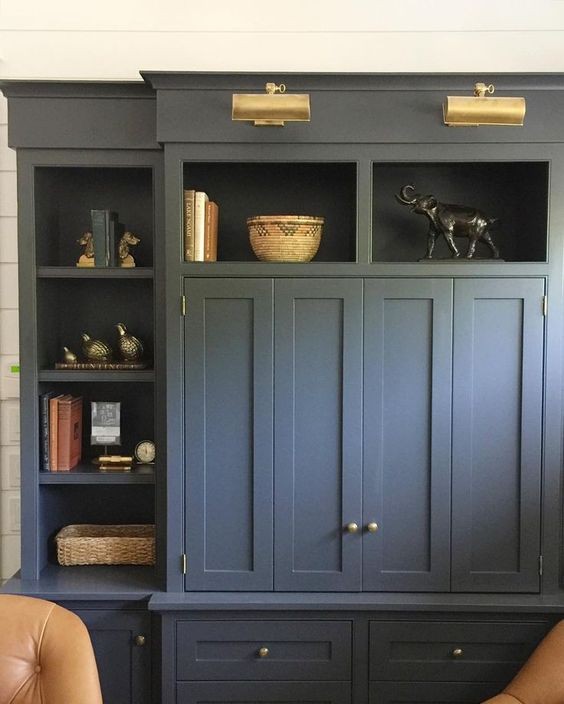 blue closed cabinets with knobs along with open shelves after renovation