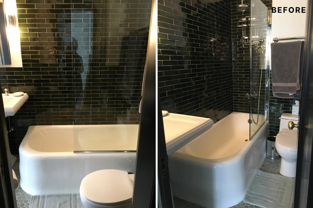 White bathtub with black wall tiles before renovation