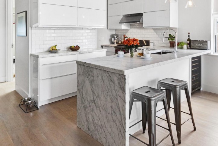 kitchen, waterfall island, marble, bar seating, subway tile, white cabinets