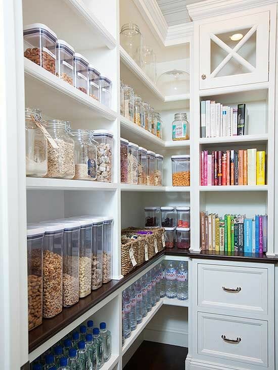 open white pantry and white drawer with handles and dark wooden flooring after renovation