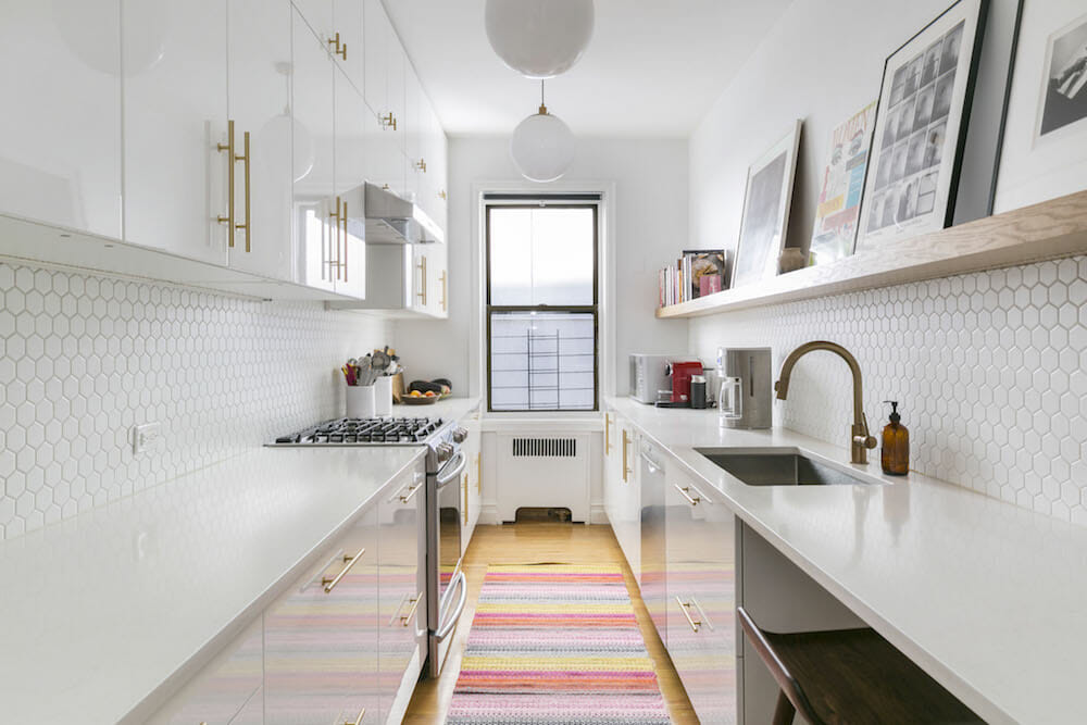 white galley kitchen with gold drawer pulls