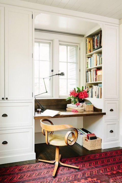 white study nook with open book shelves and brown desk and white drawers after renovation