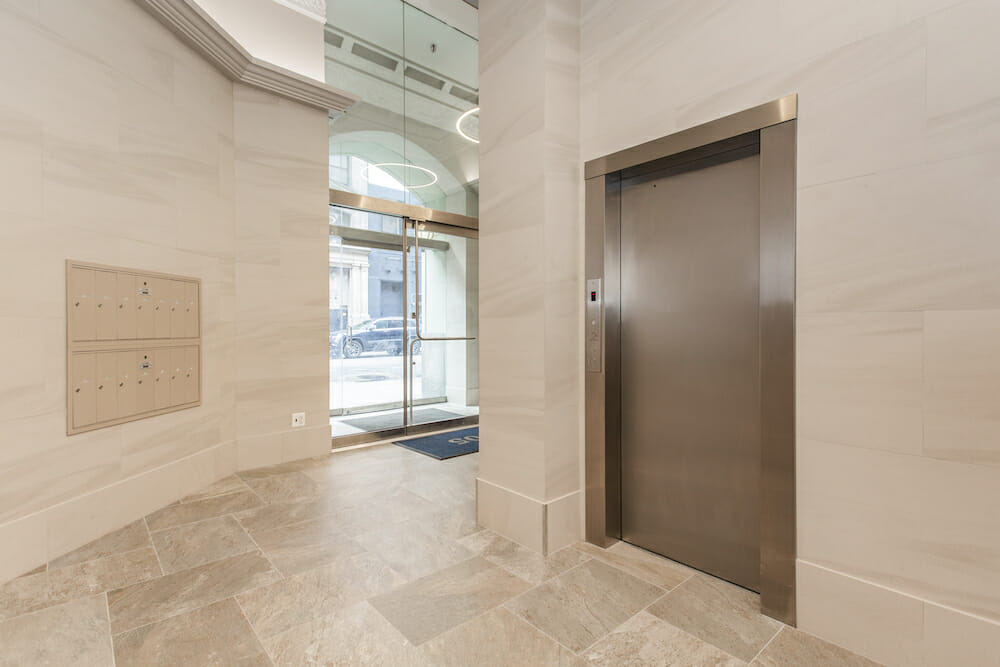A newly-renovated New York City lobby featuring with new stone entryway