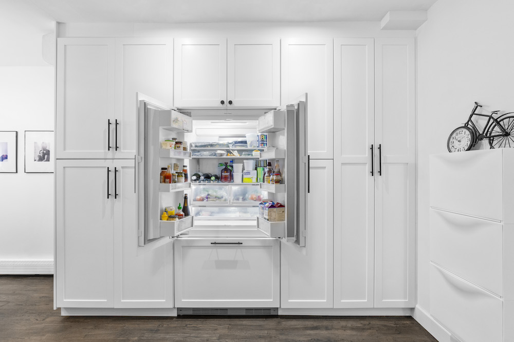 tall kitchen cabinets with hidden fridge