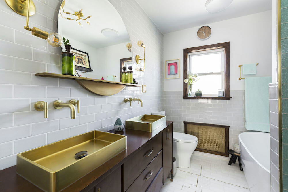Image of gold sink and gold lighting finishes in a bathroom