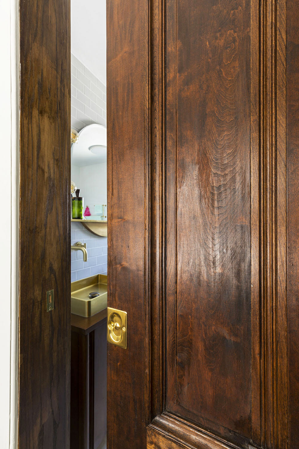 dark wooden door with grains to bathroom after renovation
