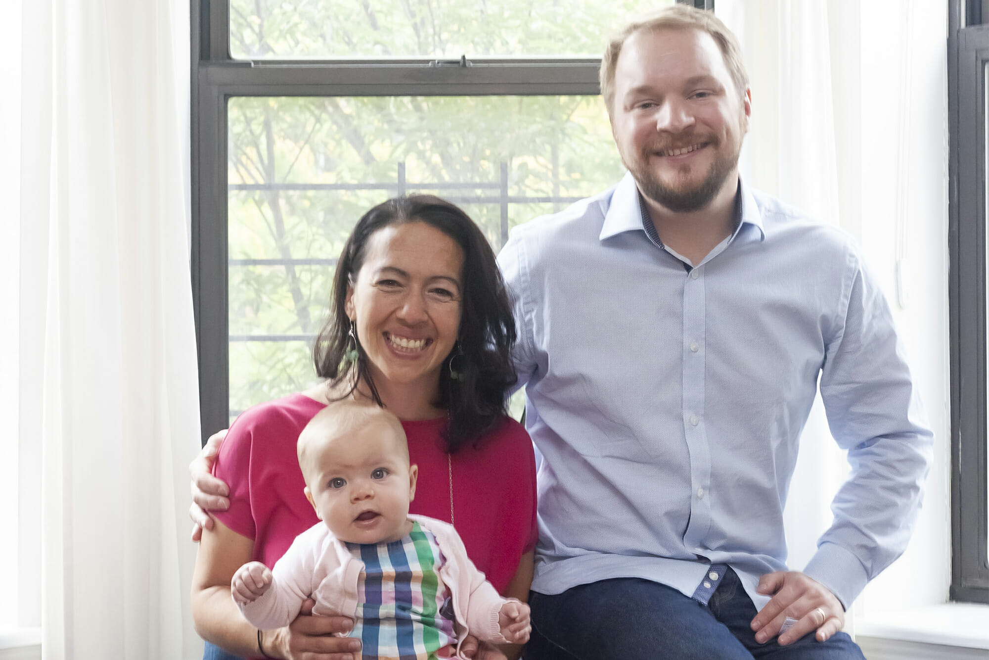 Photo of tara with her husband and baby after renovation