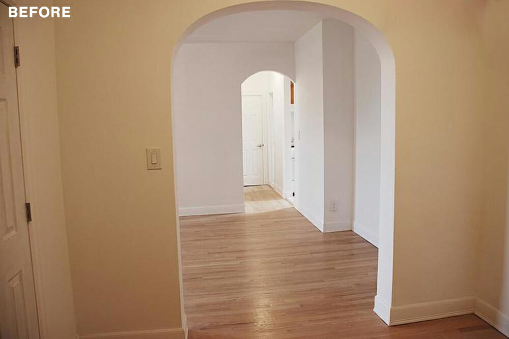 rooms with beige and white walls and hardwood floors and archways before renovation