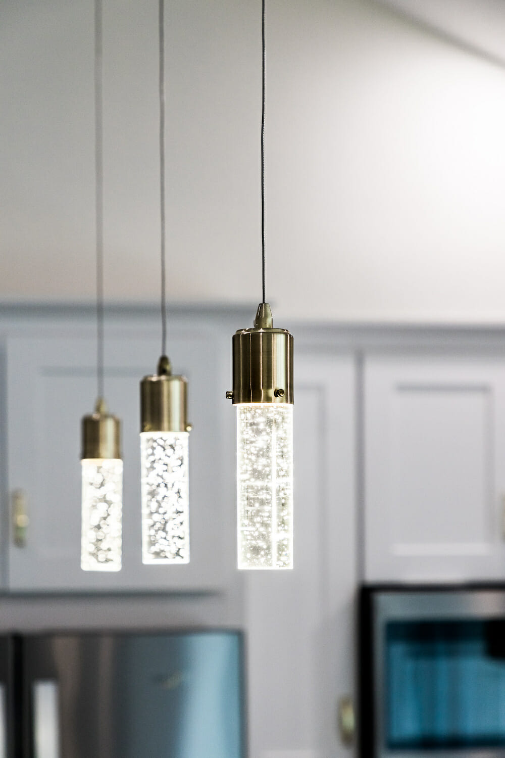 modern led bubble crystal hanging lamps or chandelier in kitchen after renovation