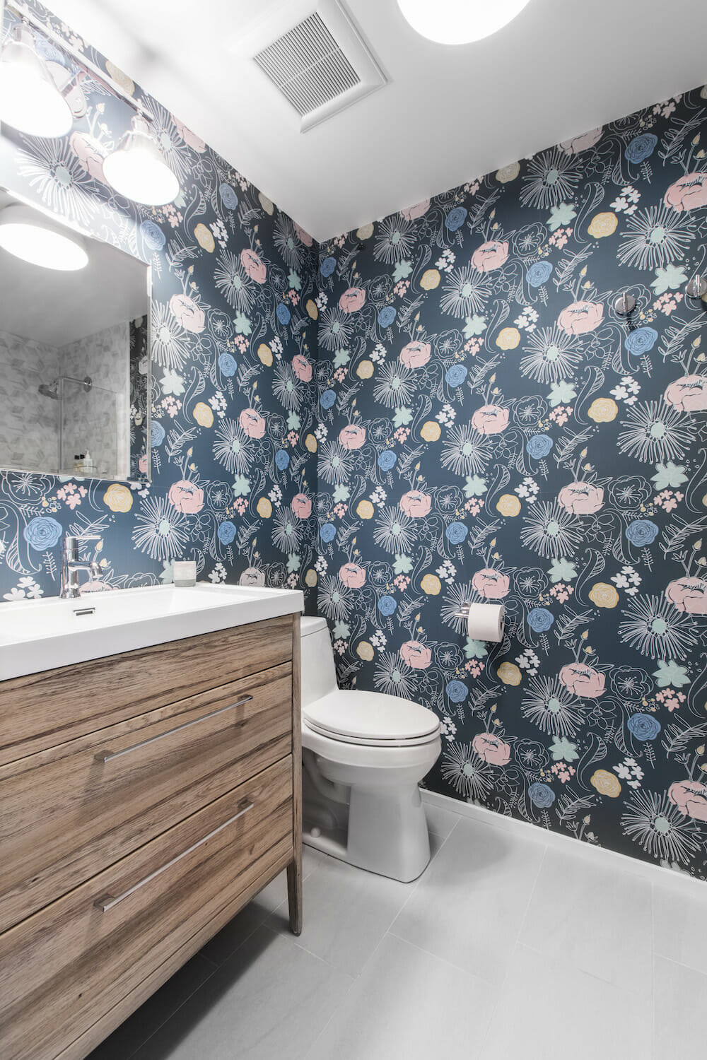 bathroom with blue, yellow, pink floral wallpaper