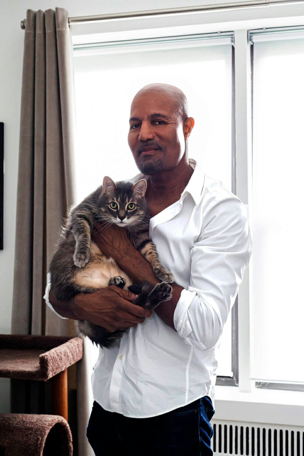 homeowner portrait holding pet cat