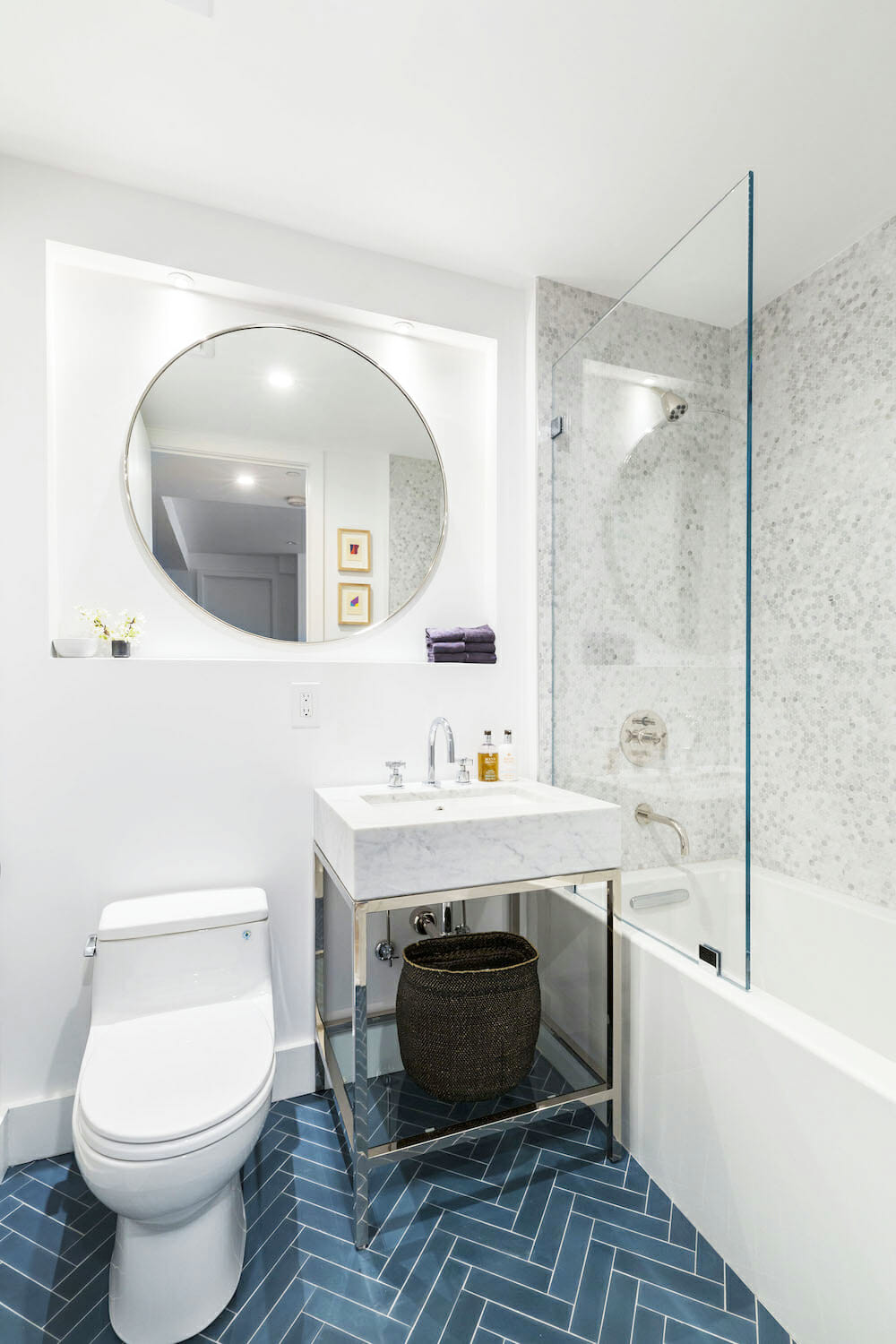 bathroom with blue cement tile in herringbone pattern