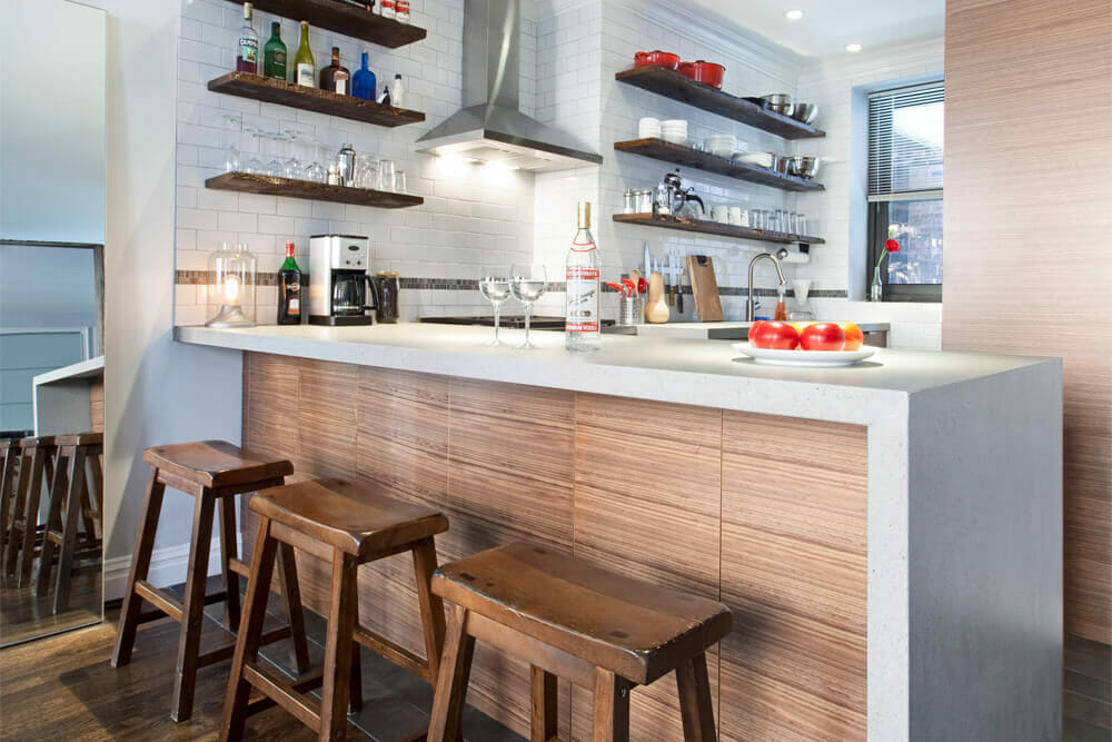 Image of wooden kitchen peninsula with bar stools