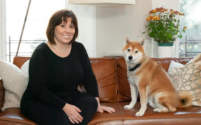 photo of nadia with her dog on sofa after renovation