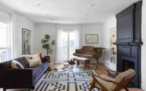 Living room with black fireplace in home and ADU remodel in Los Angeles