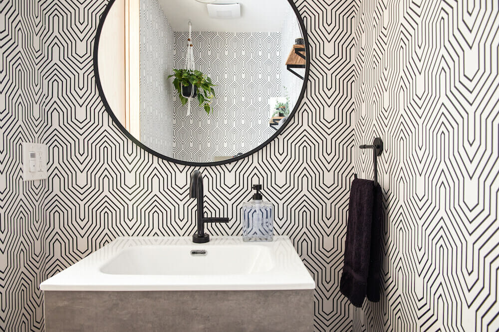 Image of black and white geometric wallpaper in powder room