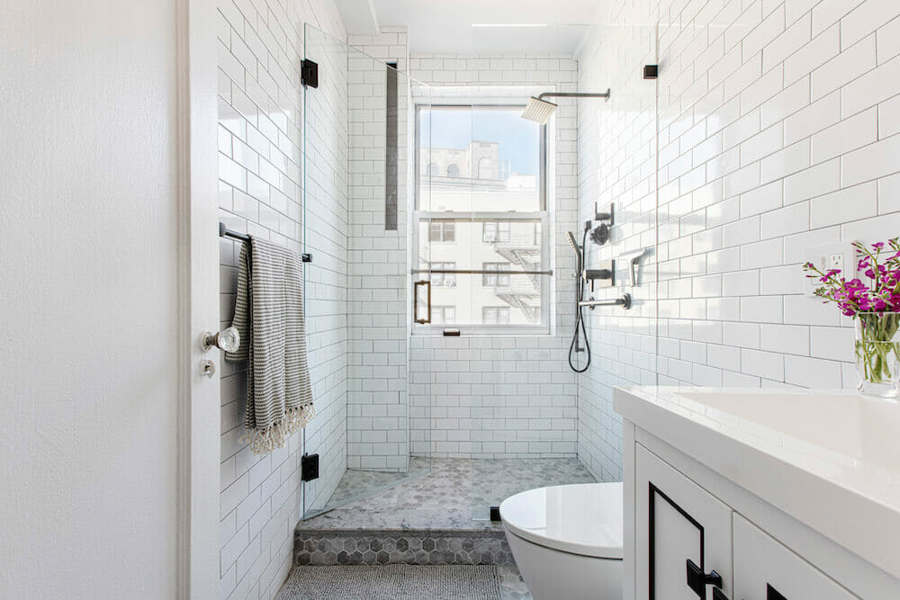 Image of a white bathroom with walk-in shower
