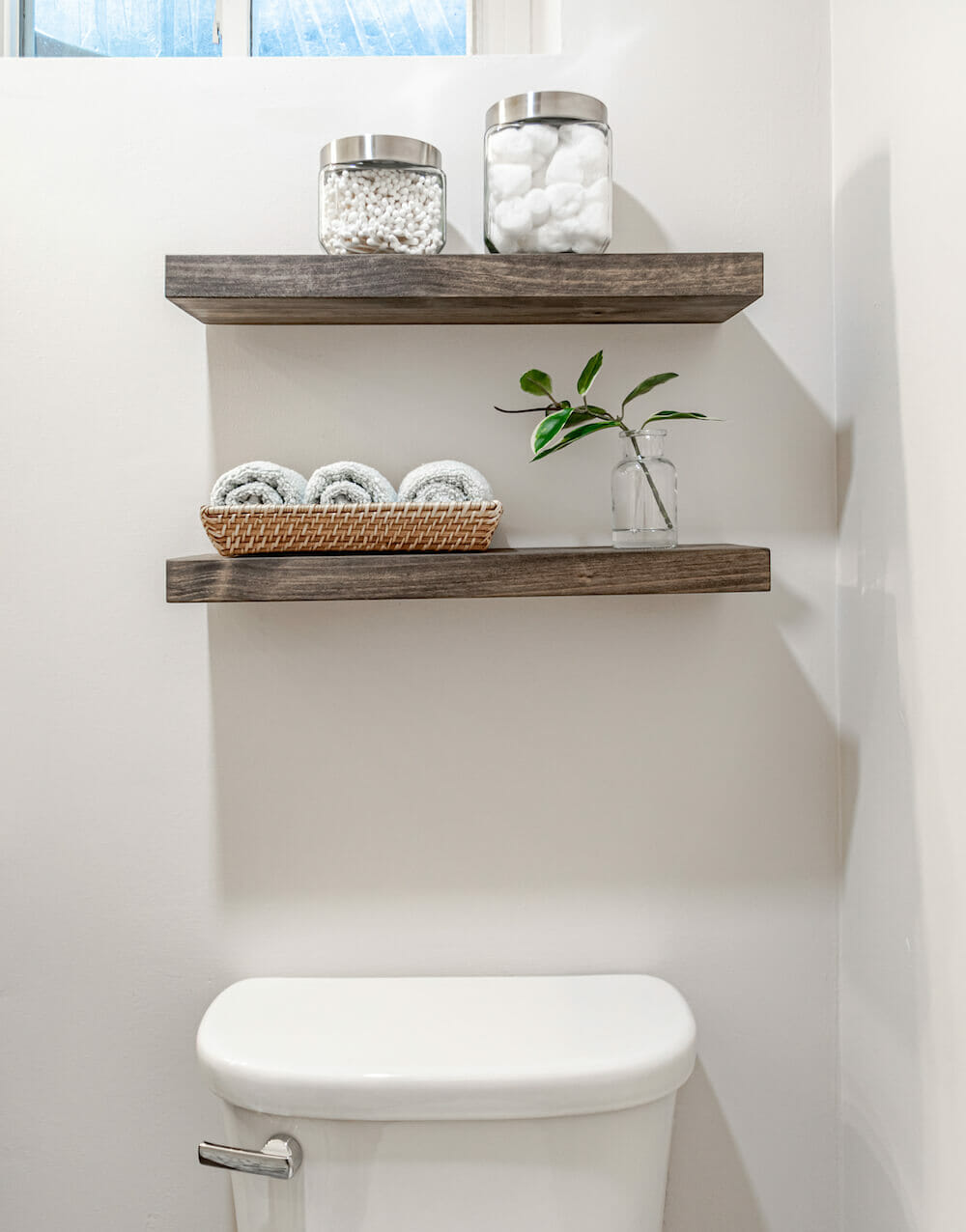 Image of open wooden shelves in bathroom