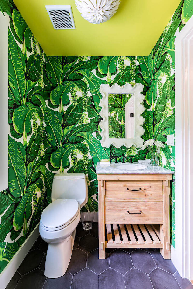 wallpaper in bathrooms with green florals and yellow painted ceiling