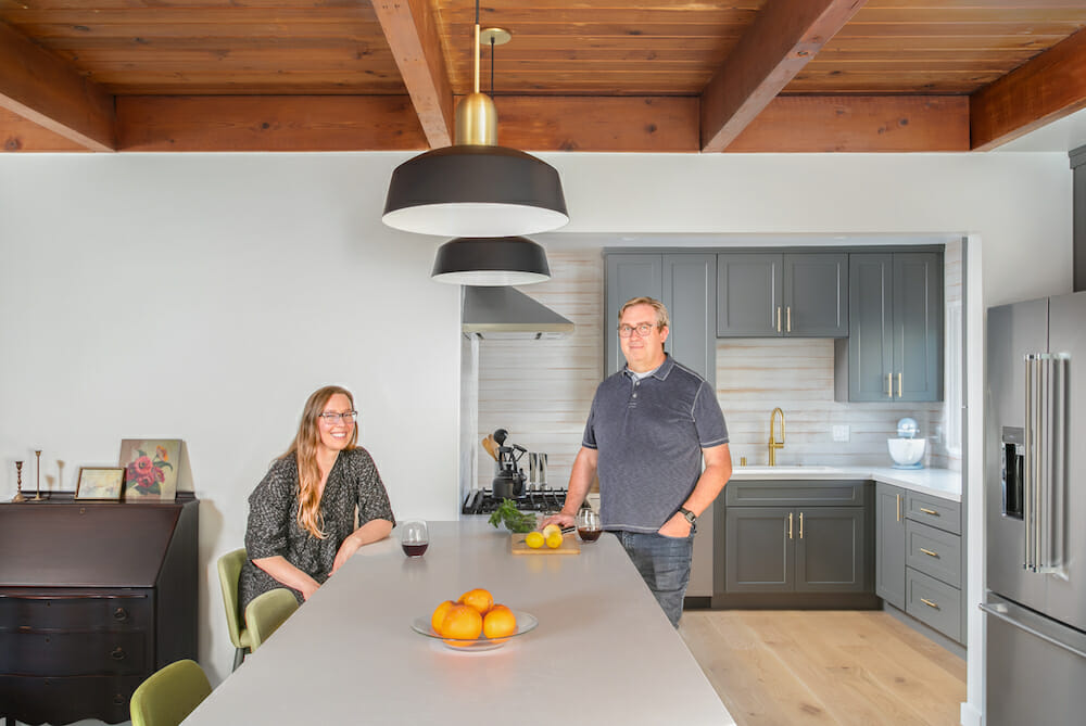 Two Los Angeles homeowners smiling in their Sweeten-remodeled house