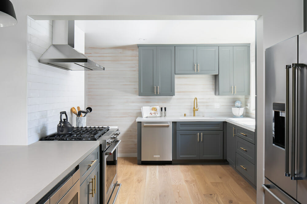 Image of a renovated kitchen with custom gray kitchen cabinets