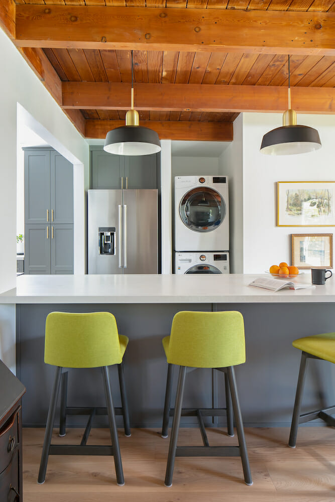 Image of a kitchen peninsula with bar stool seating